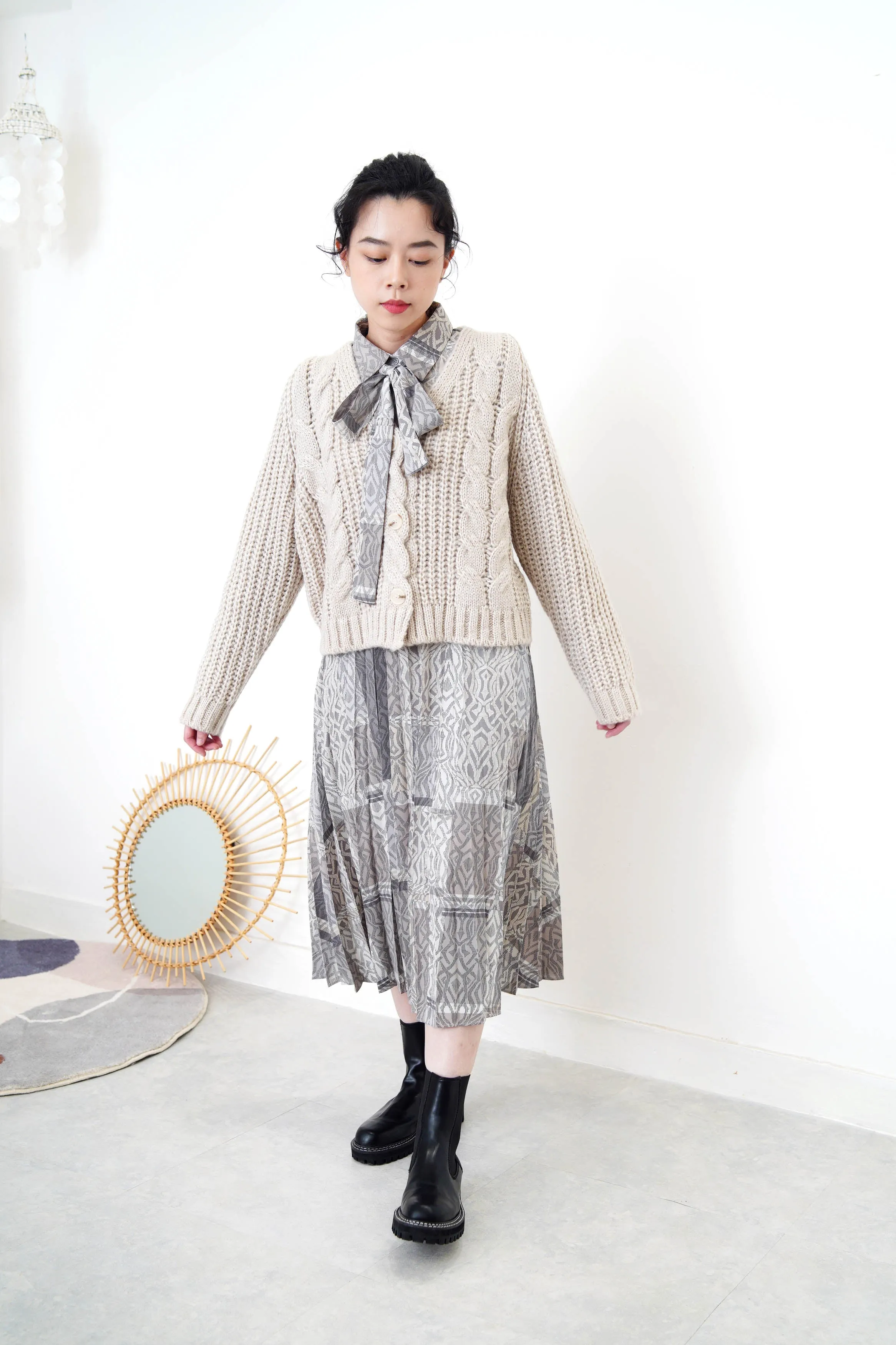Grey wool cardigan in twist details pattern